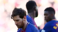 Lionel Messi saat berjoget usai mencetak gol ke gawang Athletic Bilbao di stadion Camp Nou, Spanyol (18/3). Lionel Messi berhasil mencetak satu gol pada menit ke-30 dan melakukan selebrasi yang tak biasanya. (AP Photo / Manu Fernandez)