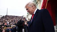 Donald Trump jelang memberikan pidato pertamanya sebagai Presiden AS di Capitol Hill, Washington DC, AS, Jumat (20/1). Dikabarkan, Trump sendiri yang menulis dan menyusun pidato pelantikannya. (AFP Photo)