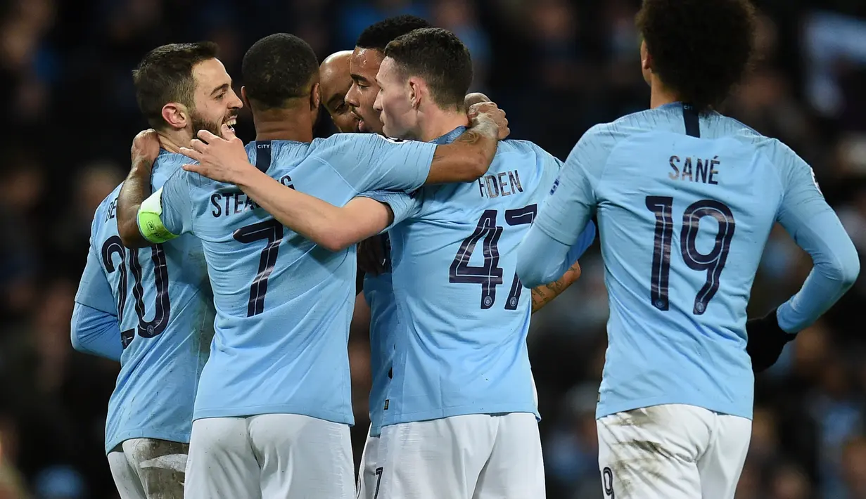 Perayaan gol Man City pada leg kedua, babak 16 besar Liga Champions yang berlangsung di Stadion Etihad, Manchester, Rabu (13/3). Man City menang 7-0 atas Schalke. (AFP/Oli Scarff)