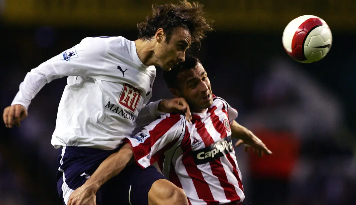 <p>Dimitar Berbatov. Striker asal Bulgaria yang telah pensiun pada April 2018 bersama Kerala Blasters di Liga Super India ini pernah berseragam Tottenham Hotspur selama 3 musim mulai 2006/2007 hingga awal musim 2008/2009 usai didatangkan dari Bayer Leverkusen. Bersama The Lilywhites, ia total tampil dalam 102 laga di semua ajang dengan torehan 46 gol dan 24 assist. (AFP/Carl De Souza)</p>