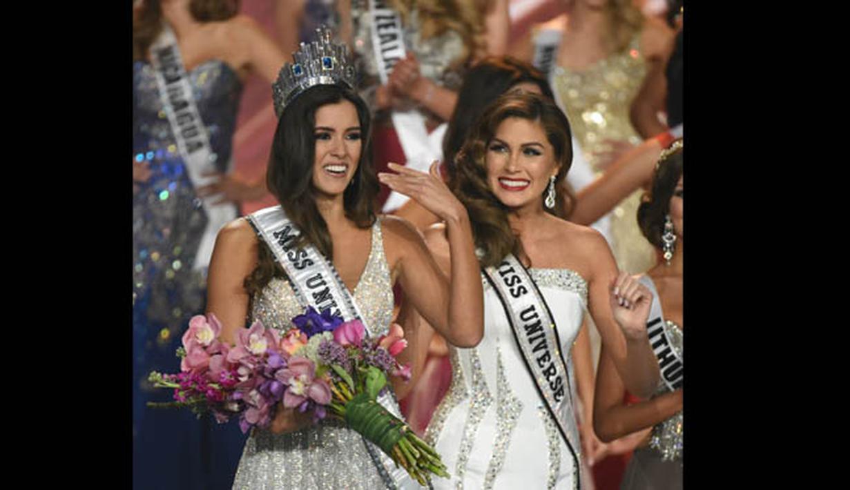 Finalis asal Kolombia, Paulina Vega tampak sangat bahagia saat dirinya dinyatakan sebagai pemenang kontes Miss Universe 2014 yang digelar di FIU Arena, Doral, Miami, Minggu (25/1/2015). (AFP PHOTO/Timothy A. CLARY)