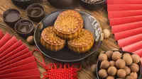 Ilustrasi kue kerangjang, nian gao, Imlek. (Photo created by dashu83 on www.freepik.com)