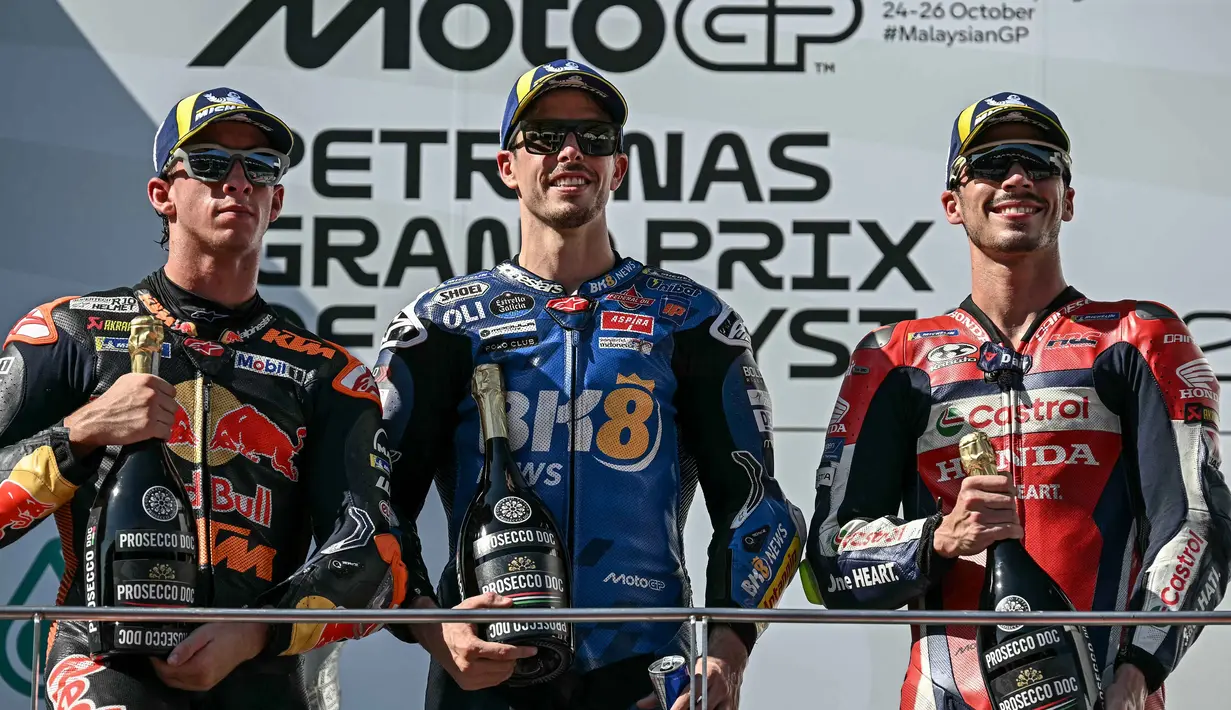 Dan, peringkat ketiga diraih pembalap Honda HRC Castrol, Joan Mir, dengan selisih +8,048 detik. (Lillian SUWANRUMPHA/AFP)