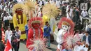 Parade ondel-ondel mengiringi rombongan Ridwan Kamil dan Suswono mendaftar sebagai peserta Pemilihan Gubernur DKI Jakarta 2024. (Liputan6.com/Herman Zakharia)