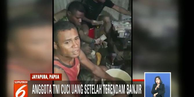 Video Anggota TNI Bersihkan Uang Sisa Banjir Bandang Sentani Viral