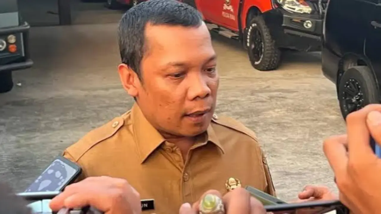 Mantan Sekretaris DPRD Riau Muflihun usai diperiksa polisi terkait korupsi SPPD beberapa waktu lalu.