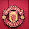 Logo Manchester United atau MU di Stadion Old Trafford. (Oli SCARFF / AFP)