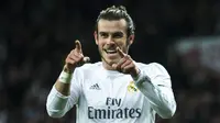 Gelandang Real Madrid, Gareth Bale, merayakan gol yang dicetaknya ke gawang Deportivo pada laga La Liga di Stadion Santiago Bernabeu, Madrid, Sabtu (9/1/2016). (AFP/Gonzalo Arroyo)