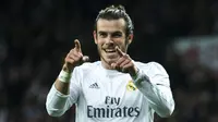 Gelandang Real Madrid, Gareth Bale, merayakan gol yang dicetaknya ke gawang Deportivo pada laga La Liga di Stadion Santiago Bernabeu, Madrid, Sabtu (9/1/2016). (AFP/Gonzalo Arroyo)