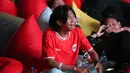 Fajar Sadboy menangis saat nobar laga Timnas Indonesia vs China di Kompleks Stadion Utama Gelora Bung Karno (SUGBK), Senayan, Jakarta, Selasa (15/10/2024) malam WIB. (Bola.com/Abdul Aziz)