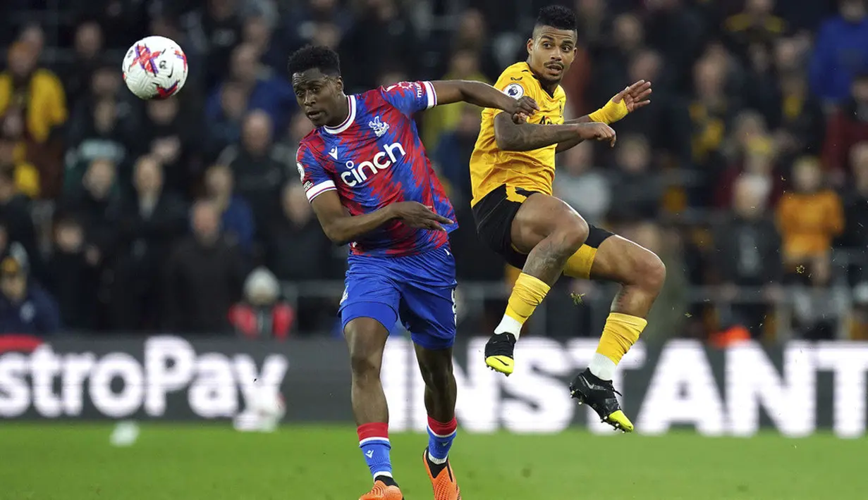 <p>Dua gol Wolverhampton Wanderers tercipta melalui bunuh diri bek Crystal Palace, Joachim Andersen, pada menit ke-3 dan sepakan penalti Ruben Neves menit ke-90+4. (Nick Potts/PA via AP)</p>