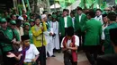 Atraksi budaya betawi palang pintu menyambut kedatangan Ketua Umum PPP Suryadharma Ali di Tugu Proklamasi (Liputan6.com/Helmi Fithriansyah)