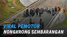 Sejumlah pemotor tampak santai nongkrong di sebuah jalur penyelamat.