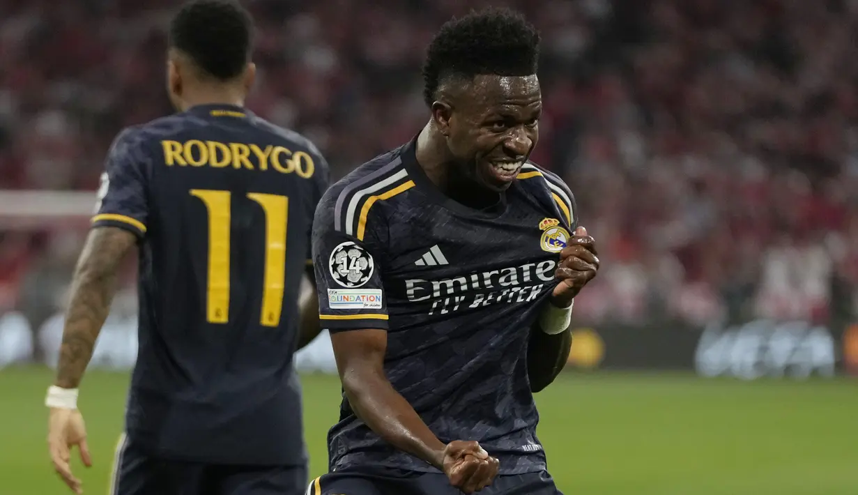 Sementara dua gol Madrid diborong oleh Vinicius Junior (24', 83'). (AP Photo/Matthias Schrader)