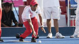 Kacung atlet Lawnball Indonesia bertanding di nomor B2 Open Single's pada Asian Para Games 2018 di Stadion Hockey, Gelora Bung Karno Jakarta, Senin (8/10/2018).  (Bola.com/Peksi Cahyo)