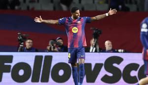 Penyerang Barcelona, Marcus Rashford, berselebrasi setelah mencetak gol ke gawang Olympiakos pada pada laga Liga Champions di Estadi Olimpic Lluis Companys, Rabu (22/10/2025) dini hari WIB. (Josep Lago/AFP)
AFP