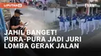 Sejumlah wilayah menggelar lomba gerak jalan memeriahkan HUT RI ke-78. Warga pun berkumpul di jalanan menyaksikan, tak terkecuali pria jahil satu ini. Ia berpura-pura menjadi juri, hingga para peserta terkecoh.