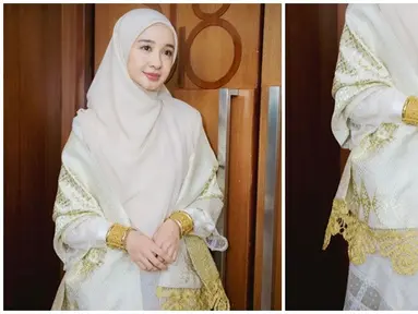 Laudya Cynthia Bella berperan sebagai Siti Raham istri Buya Hamka di film Buya Hamka. Hadiri gala premiere film Buya Hamka, sahabat Zaskia Sungkar itu pakai baju Minang lengkap dengan aksesori dan selendangnya. Polesan makeup dan warna jilbab yang senada membuat Bella kian memesona. Setelah lama tak muncul di layar lebar, film tersebut tentunya mengobati kerinduan penggemar terhadap akting Laudya Cynthia Bella. (Liputan6.com/IG/@laudyacynthiabella)