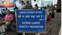 Rambu di Bandara India melarang Penumpang Makan Karpet 