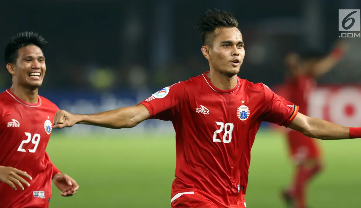 Bek Persija, M Rezaldi Hehanusa berlari merayakan gol yang dicetaknya ke gawang Tampines Rovers pada penyisihan grup H Piala AFC 2018 di Stadion GBK, Jakarta, Rabu (28/2). Persija unggul 4-1. (Liputan6.com/Helmi Fithriansyah)