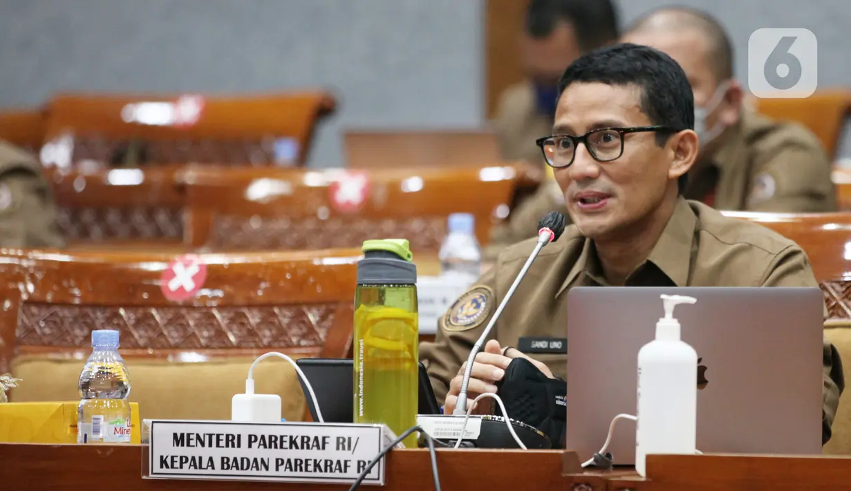 <p>Menparekraf Sandiaga Uno saat rapat kerja dengan Komisi X DPR di Gedung Nusantara I, Jakarta, Rabu (16/3/2022). Rapat membahas kesiapan dukungan pelaksanaan MotoGP Mandalika 2022, strategi pemulihan dan penguatan Kemenparekraf pascamelandainya pandemi COVID-19. (Liputan6.com/Angga Yuniar)</p>