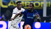 Skor 3-1 tidak berubah hingga akhir pertandingan. Tampak dalam foto, bek Bologna asal Kolombia, Jhon Lucumi (kiri) dan penyerang Inter Milan asal Prancis, Marcus Thuram (kanan), berebut bola selama pertandingan pekan ke-17 Serie A Italia di Stadion San Siro, Milan, Minggu (4/1/2026) waktu setempat atau Senin (5/1/2026) dini hari WIB. (Piero CRUCIATTI/AFP)