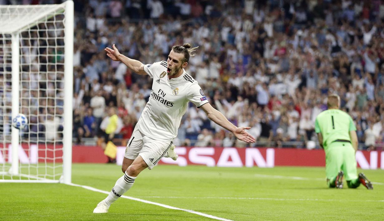 Penyerang Real Madrid, Gareth Bale, melakukan selebrasi usai membobol gawang AS Roma pada laga Liga Champions di Stadion Santiago Bernabeu, Madrid, Rabu (19/9/2018). Real Madrid menang 3-0 atas AS Roma. (AP/Manu Fernandez)