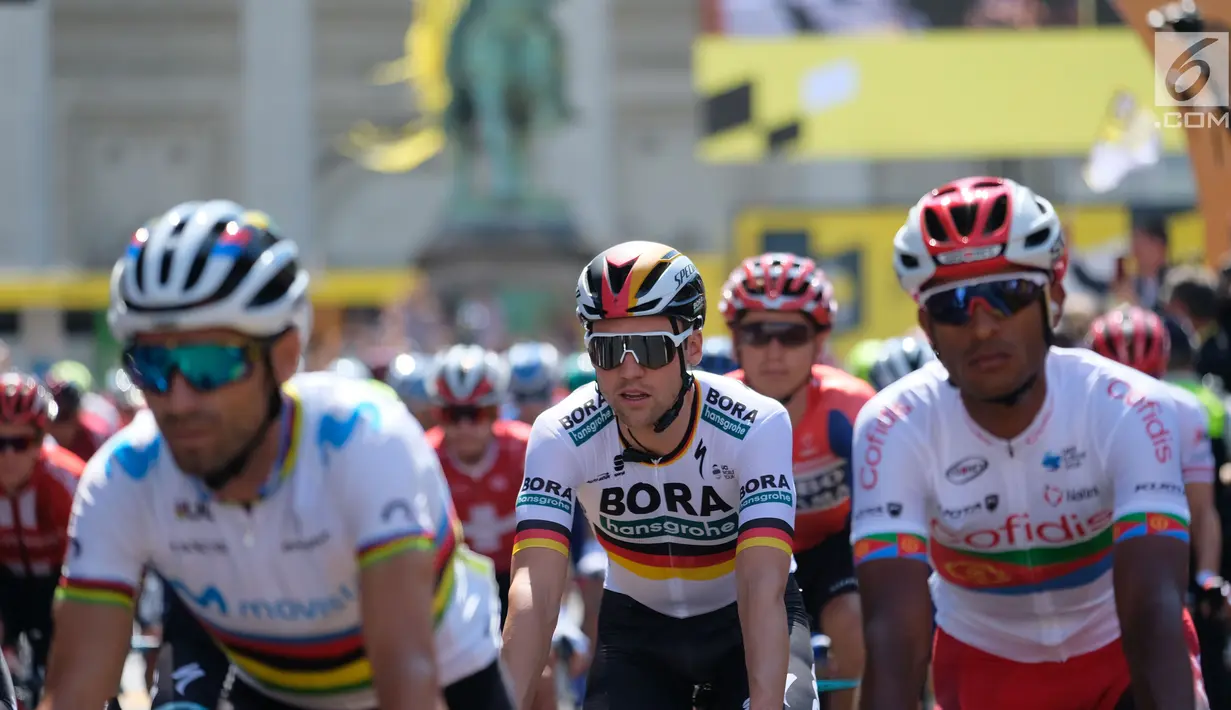 Peserta saat mengikuti Tour de France (TdF) 2019 dari kota Brussels, Belgia (7/7/2019. Tour de France 2019 akan menempuh jarak total 3.640 km terbagi 21 etape dan akan  mencapai finis akhir  di Paris ibuk ota Prancis Minggu 28 Juli 2019. (Liputan6.com/HO/Arie Asona)
