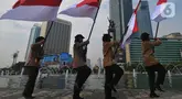 Upacara pengibaran Bendera Merah Putih selama bulan Agustus 2024 di Kawasan Bundaran HI, Jakarta, Kamis (8/8/2024). (merdeka.com / Imam Buhori)