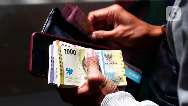 Warga Mulai Berburu Penukaran Uang Baru Lebaran