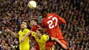 Striker Liverpool, Divock Origi, duel udara dengan pemain Dortmund pada laga Liga Europa di Stadion Anfield, Inggris, Jumat (15/4/2016) dini hari WIB. Liverpool mampu membalikan keadaaan menjadi 4-3. (AFP/Oli Scarff)