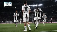 Pemain Juventus merayakan gol yang dicetak Paulo Dybala pada laga melawan Bologna (26/9/2018). (AFP/Marco Bertorello)