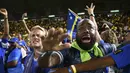 Kepastian tersebut didapat setelah berhasil menahan imbang Jamaika 0-0 pada laga terakhir Grup B Kualifikasi Piala Dunia 2026 zona CONCACAF di Independence Park Stadium, Jamaika, Rabu (19/11/2025) WIB. Tampak dalam foto, suporter Timnas Curacao merayakan hasil imbang melawan Jamaika pada Grup B Kualifikasi Piala Dunia 2026 zona CONCACAF di Independence Park Stadium, Jamaika pada 18 November 2025. (Ricardo MAKYN/AFP)