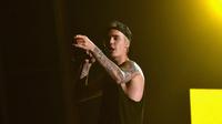 Membatalkan tur konser keliling dunianya, Justin mengungkapkan alasan di balik semuanya. Lewat media sosial, Justin mengunggah sebuah foto berupa kalimat yang menyatakan alasan batalnya konser itu. (AFP/LARRY BUSACCA)