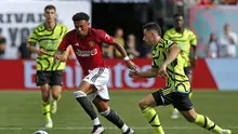 Aksi Jadon Sancho saat mencetak gol untuk Manchester United. Kecepatannya membuat dia mampu menaklukkan bek Arsenal di tur pramusim yang berkesudahan dengan skor 2-0 untuk MU (AFP)