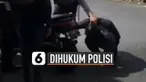 Nasib apes dialami oleh pengendara motor ini karena harus dihukum polisi akibat menggunakan knalpot bising dan motornya rusak.