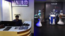 Dalam gambar yang diambil pada 26 Oktober 2018, pelayan robot bernama Ginger mengantarkan makanan untuk pelanggan di restoran Naulo di Kathmandu. Robot pelayan ini merupakan yang pertama ada di Nepal. (Prakash MATHEMA/AFP)