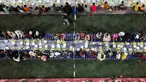 Foto udara ini menunjukkan acara buka puasa bersama yang diselenggarakan oleh sebuah badan amal untuk lebih dari seribu anak, termasuk 800 anak yatim piatu, di sebuah lapangan sepak bola di kota Binnish, provinsi Idlib, Suriah, pada 29 Maret 2024. (Omar HAJ KADOUR/AFP)