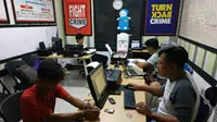 Tersangka TM menundukkan kepala saat diperiksa polisi. (foto: Liputan6.com / suarakalbar.co.id)