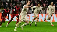 Bayern Munchen meraih kemenangan 3-0 atas Bayer Leverkusen pada laga leg pertama 16 besar Liga Champions di Allianz Arena, Kamis (6/3/2025) dini hari WIB. Dua dari tiga gol Die Bayern disumbangkan Harry Kane. (AFP/Tobias SCHWARZ)