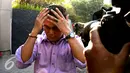 Anggota DPRD Kabupaten Musi Banyuasin (Muba), Aidil Fitri usai menjalani pemeriksaan KPK, Jakarta, Rabu (26/8/2015). Aidil diperiksa KPK sebagai saksi terkait dugaan suap pembahasan RAPBD 2015 dan LKPJ 2014. (Liputan6.com/Yoppy Renato)