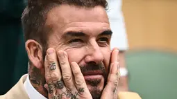 David Beckham mengambil waktu istirahat dari mengawasi performa buruk tim Inter Miami-nya untuk beraksi di Centre Court di Wimbledon pada hari Rabu. (AFP/Sebastien Bozon)