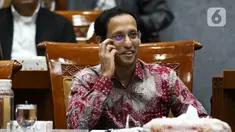 Menteri Pendidikan dan Kebudayaan Nadiem Makarim saat rapat dengan Komisi X DPR di Kompleks Parlemen, Senayan, Jakarta, Kamis (12/12/2019). Rapat membahas penghapusan Ujian Nasional (UN) pada 2021 dan sistem zonasi. (Liputan6.com/Johan Tallo)