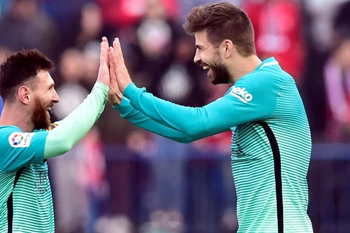 Lionel Messi dan Gerard Pique