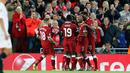 Pemain Liverpool, Roberto Firmino bersama rekan setimnya berselebrasi setelah membobol gawang Sevilla dalam laga Grup E Liga Champions di Stadion Anfield, Rabu (13/9). Sevilla berhasil menahan imbang Liverpool dengan skor 2-2. (AP Photo/Frank Augstein)