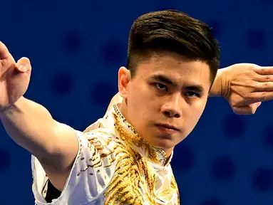 Aksi atlet wushu asal Indonesia Edgar Xavier Marvelo saat berkompetisi pada nomor wushu final changquan putra Asian Games 2023 di Hangzhou, China, Minggu (24/9/2023). (Ishara S. KODIKARA/AFP)
