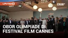 Obor Olimpiade dibawa di karpet merah Festival Film Cannes pada Selasa saat pemutaran perdana film "Marcello Mio" yang dibintangi oleh Catherine Deneuve dan putrinya, Chiara Mastroianni. Paralimpian Prancis Arnaud Assoumani menyalakan obor tersebut s...