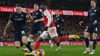 Gelandang Arsenal, Eberechi Eze, tampil impresif saat membantu timnya meraih kemenangan 4-0 atas Wigan Athletic pada laga pekan keempat Piala FA di Stadion Emirates, Minggu (15/02/2026) malam WIB. Dalam duel itu, Eze mampu mengukir dua assist. (AFP/Glyn Kirk)