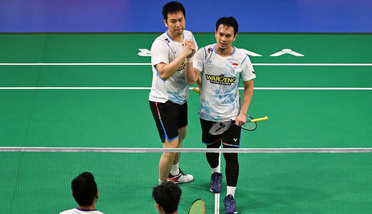 Di semifinal Australia Open 2024, Mohammad Ahsan/Hendra Setiawan akan bertemu dengan wakil Taiwan, Chen Zhi-ray/Lin Yu-chieh. (Saeed KHAN/AFP)