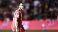 Ekspresi pemain Real Madrid, Gareth Bale, pada laga melawan Rayo Vallecano di Vallecas Stadium, Senin (29/4/2019) dini hari WIB. (AFP/Benjamin Cremel)